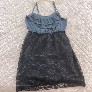 Size M. Black lace dress with blue underlay.